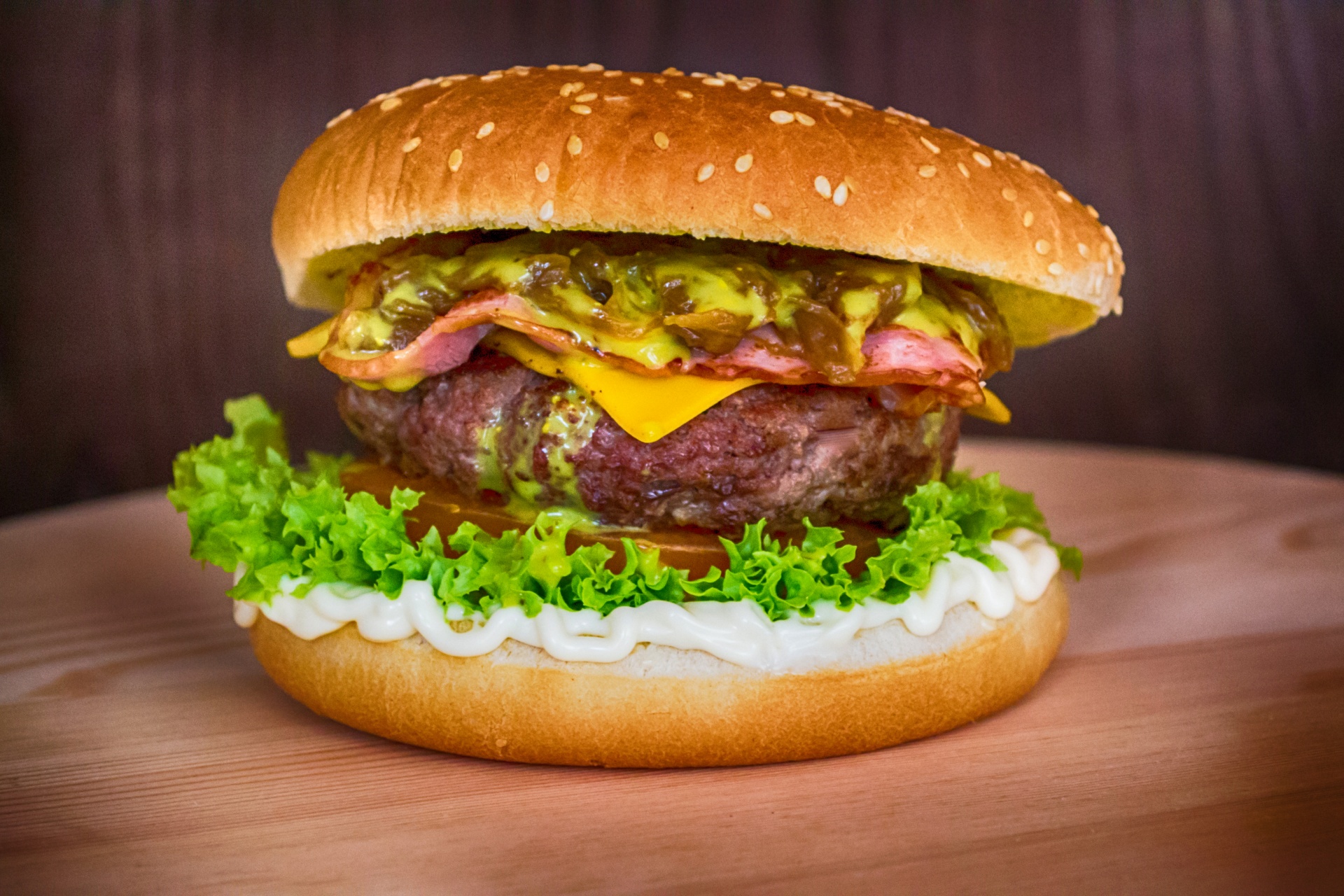 A juicy hamburger on a wooden table